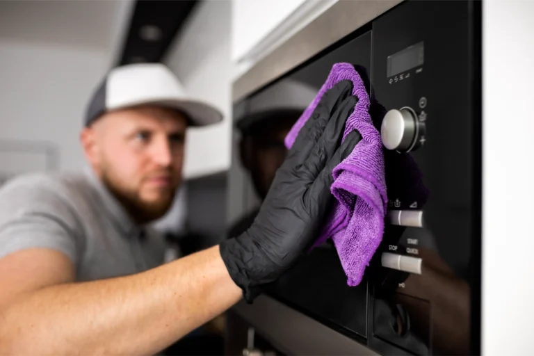 Abilene Appliance Repair technician servicing microwave